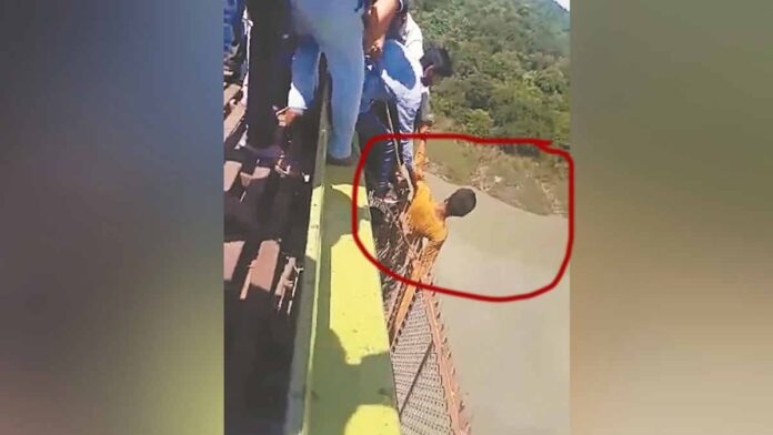 Youth attempted suicide by jumping off a bridge